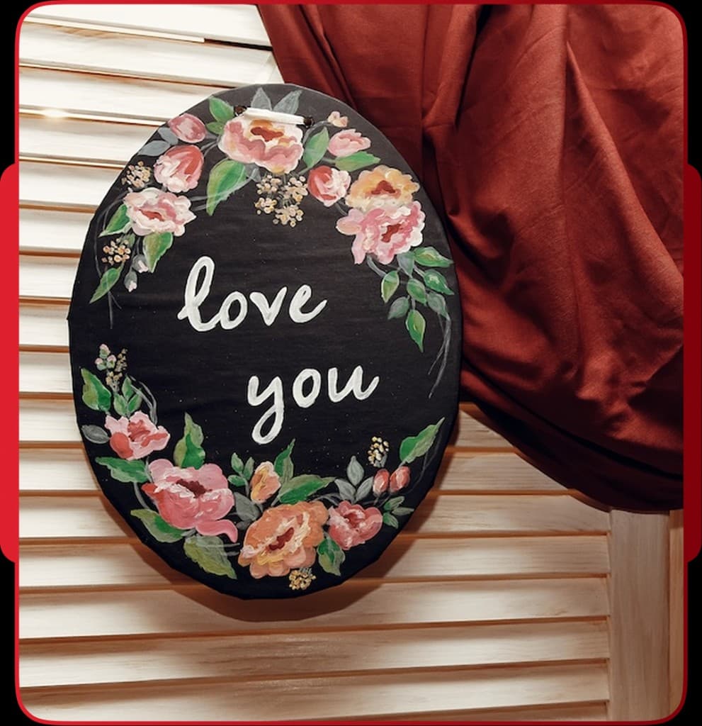 Hand-painted love you floral wedding sign